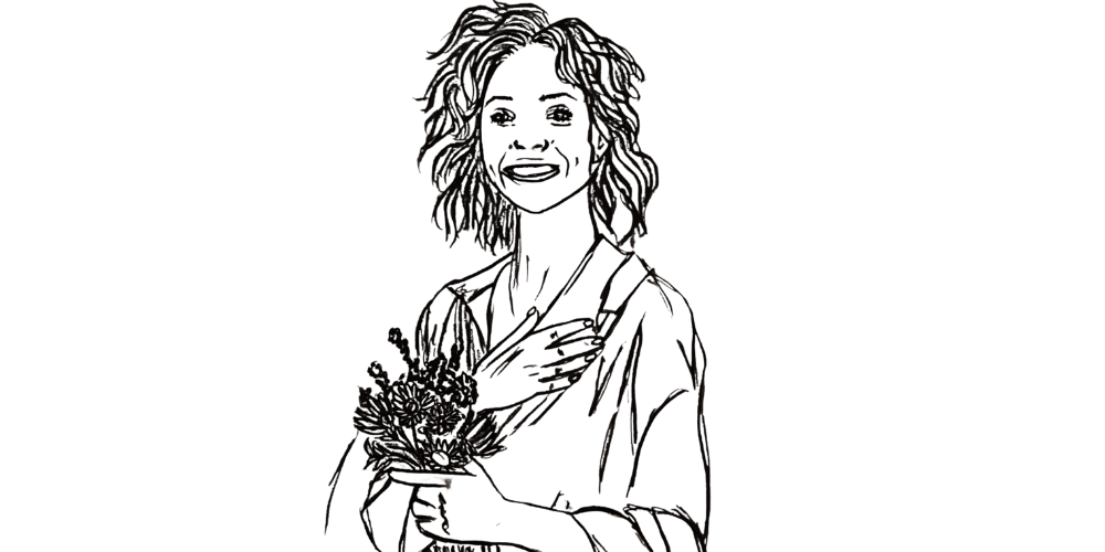 Woman holding flowers with a gentle smile