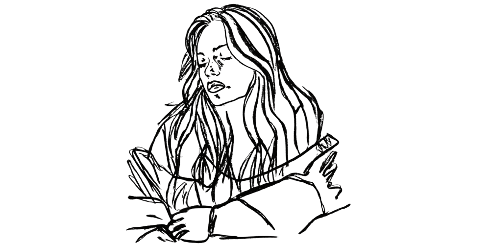 Person holding their heart gently