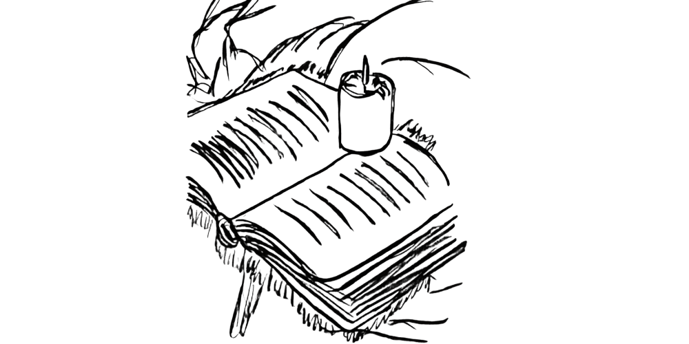 Soft candlelight on an open journal