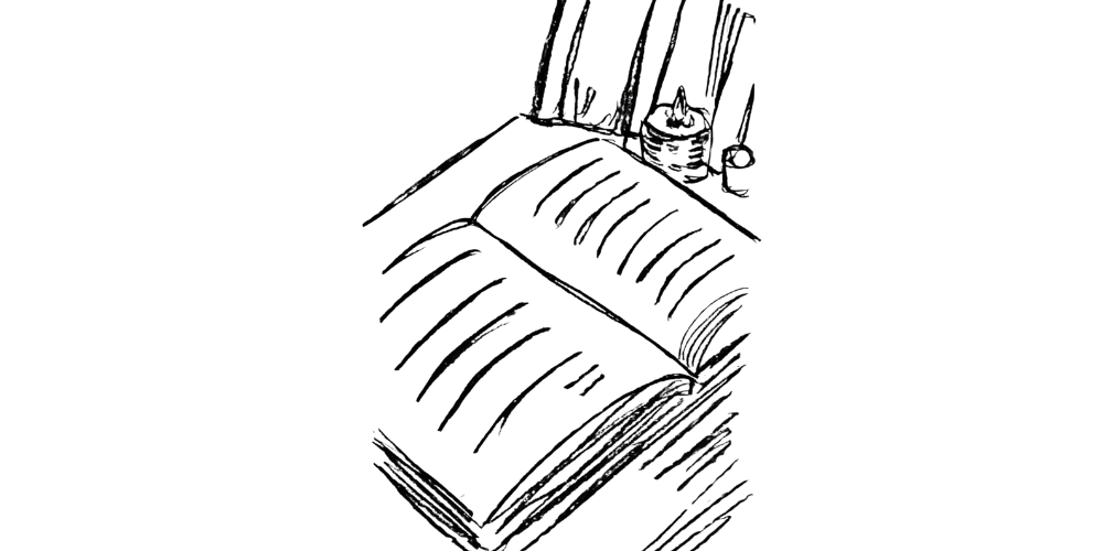 Open journal with candlelight next to it, evoking peaceful introspection.