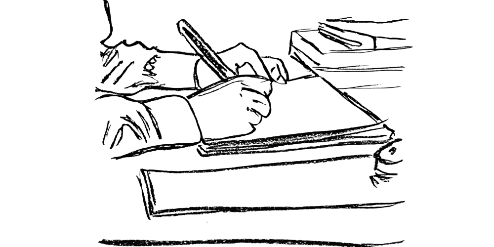 Hand hovering over a journal page, ready to begin writing.