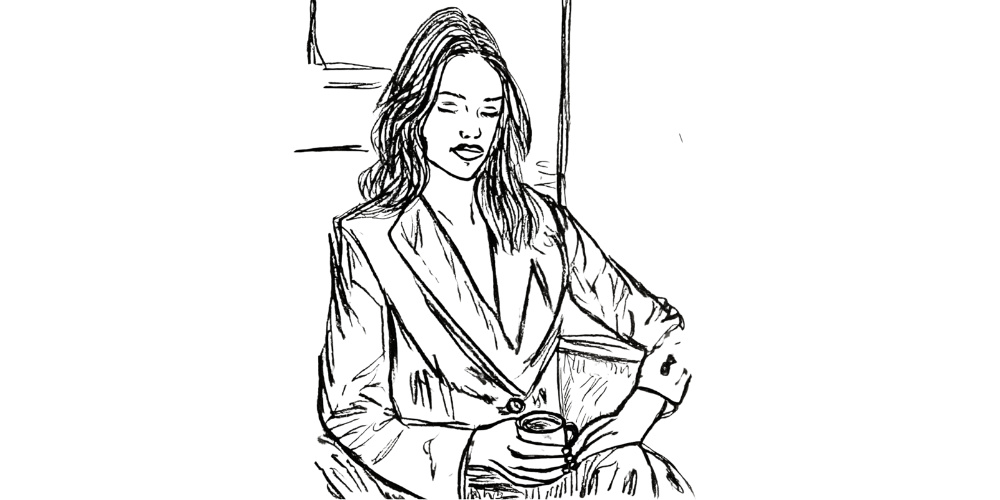 Woman holding warm drink, eyes closed in peaceful journaling moment.