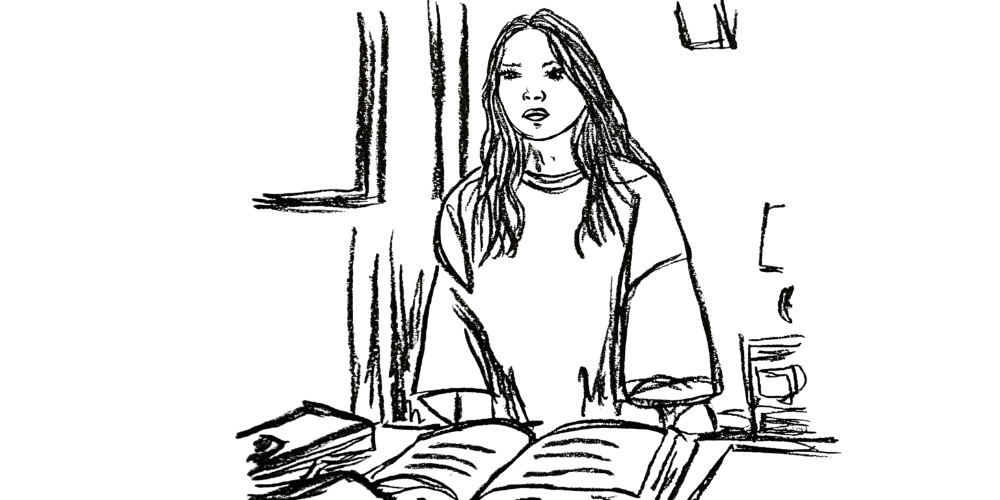 Young woman sitting with books, seeking calm in her inner sanctuary