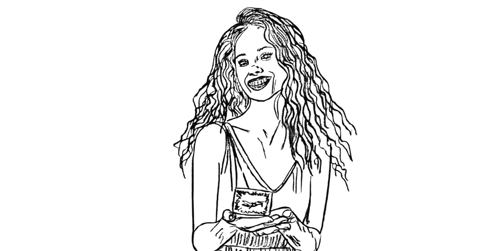 Smiling woman holding a candle and journal