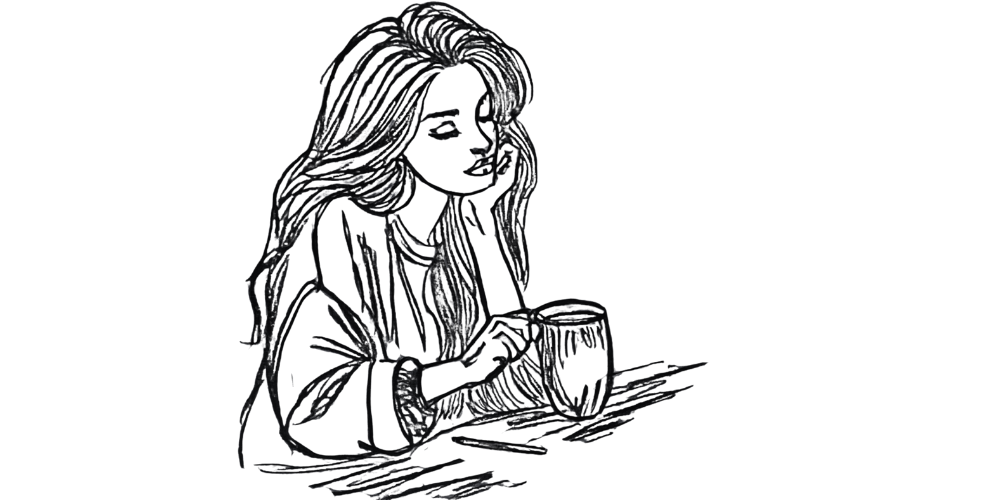 Close-up on mug and journaling hand