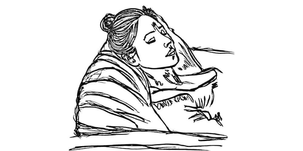 Person lying in bed, reflecting in stillness — you don’t need to be productive to deserve rest.