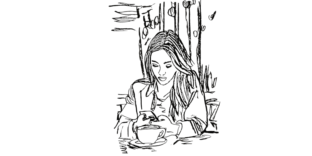 Woman with a warm drink checking her phone in a calm café, morning light