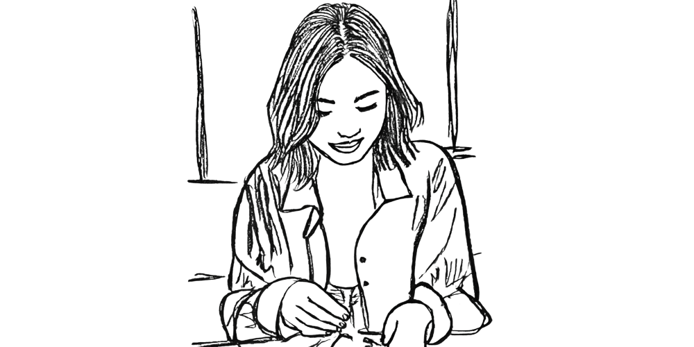 Woman writing in her journal as an act of self-care